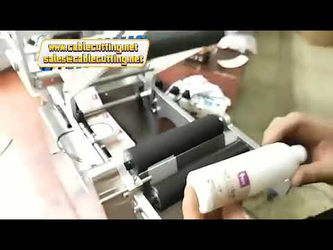 เครื่องติดสติกเกอร์ขวดกลม MT-50D อัตโนมัติ แบบกาวในตัว พร้อมพิมพ์วันที่